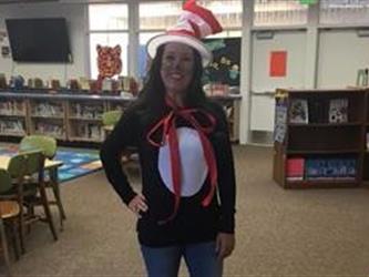 A teacher dressed up as the Cat in the Hat