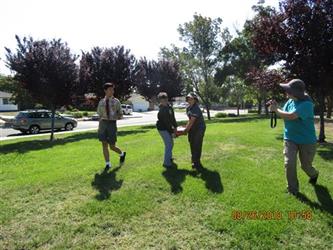 People installing benches with troop 170.