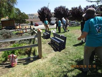 People installing benches with troop 170.