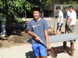 A student with a shovel