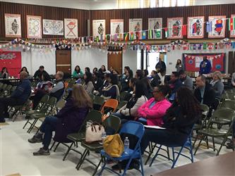 People attending a meeting in a multipurpose room