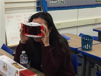 A woman looking into a device