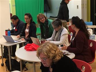 People at a table during a meeting