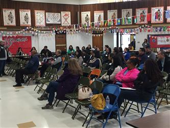 People attending a meeting in a multipurpose room